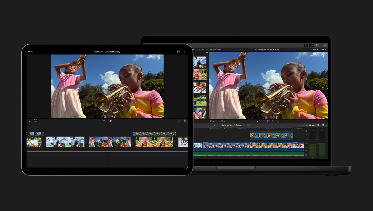 MacBook Pro 14 screen showing two girls outdoors playing trumpets, demo of iMovie import, clips, iPad Pro 13 screen showing two girls outdoors playing trumpets, demo of iMovie import, clips at the bottom