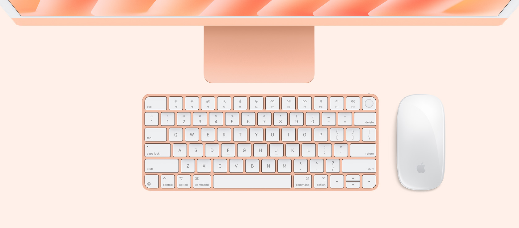 Oranž iMac ülalt alla vaates koos sama värvi hiire ja klaviatuuriga