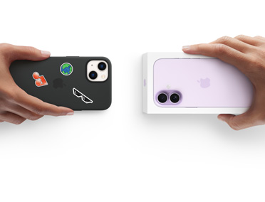 Hands exchanging trade-in iPhone 13 with Silicon cover, stickers on back exterior, for new iPhone 17 in the box.