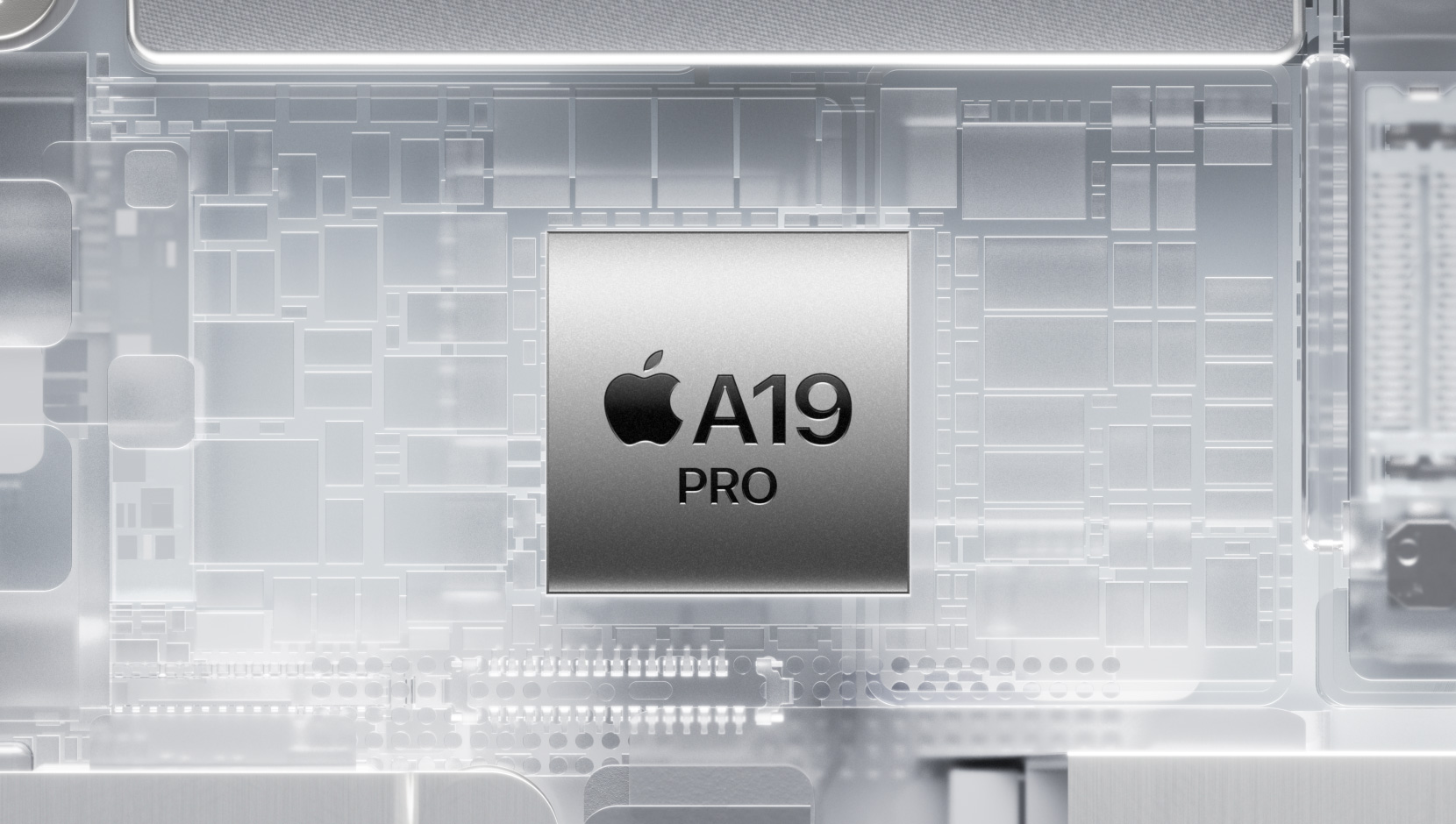 光り輝くiPhoneの内部部品に囲まれたA19 Proチップ