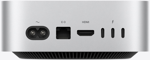 لقطة خلفية لجهاز Mac mini فضي اللون تعرض المنافذ الخلفية: منفذ طاقة واحد، ومنفذ إيثرنت واحد، ومنفذ HDMI واحد، وثلاثة من منافذ ثندربولت.