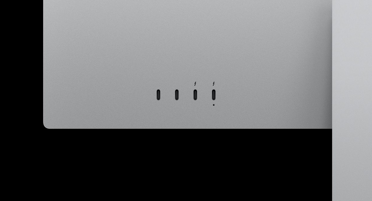 Closeup on rear of Studio Display XDR, highlighting two USB‑C ports and two Thunderbolt 5 ports